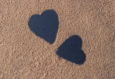 Valentine day backround heart cocoa powder on blackの写真素材