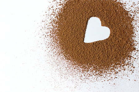 Valentine day backround heart shape cocoa powder isolated on whiteの写真素材