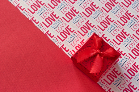 Valentines day backround red gify box with ribbon red background and lettering Loveの写真素材
