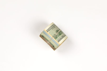 100 dollar bill roll isolated on white background