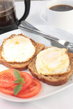Breakfast of eggs on toast with French coffeeの写真素材