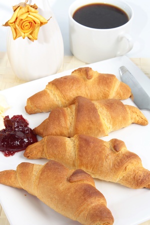 Breakfast of fresh croissants and coffeeの写真素材