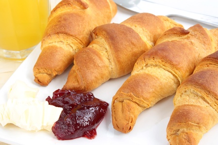 Breakfast of croissants with a glass of orange juiceの写真素材
