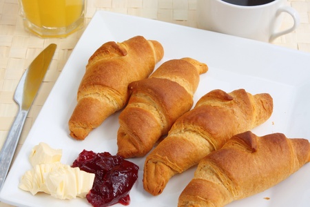 Breakfast of croissants, orange juice and coffeeの写真素材