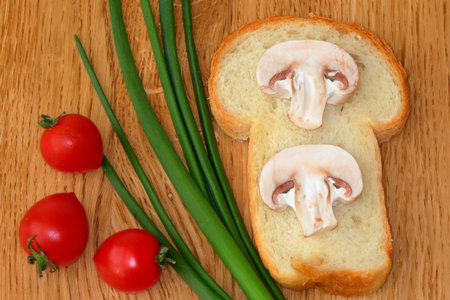 Vegetable background. Green onion, cherry tomato, mushroom, bred. Still life. Healthy vegetarian cuisine.の写真素材
