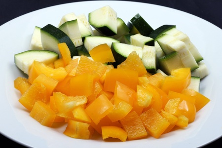 Zucchini and yellow peppers as side dishの写真素材