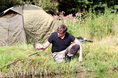 Young man practicing survival trainingの写真素材