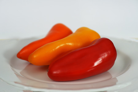 Small peppers in different colors and shapesの写真素材