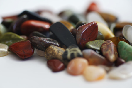 Single gemstones in front of a light background in closeupの写真素材