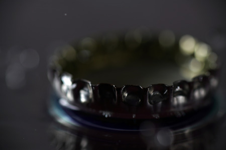 Crown of a beer bottle with drops of waterの写真素材