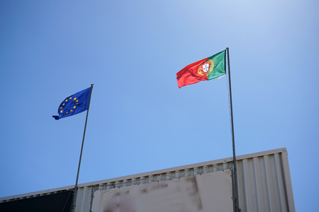 Portuguese and European flag on a building in the Algarveの写真素材