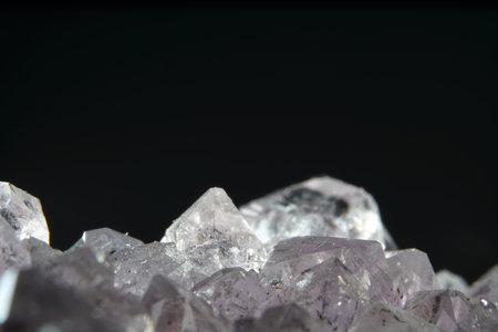 Quartz also called deep quartz photographed in studio in front of black background in Marco mode