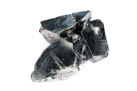 A black rock also called healing stone shungite, which consists mainly of carbon was photographed here in top quality.の写真素材
