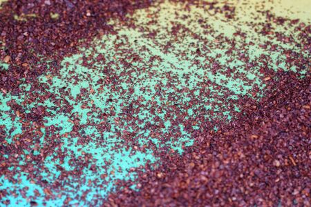Sumac spice with macro lens photographed against colorful gradient in studioの写真素材