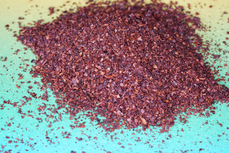 Sumac spice with macro lens photographed against colorful gradient in studio
