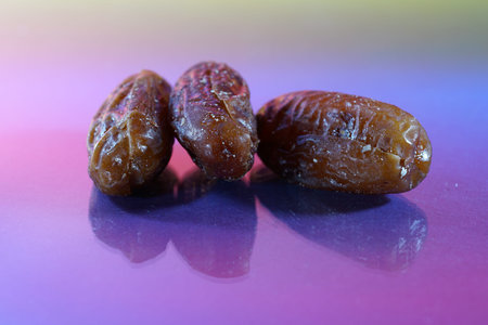 A date is the fruit of a date palm, photographed here in the studio as a detail