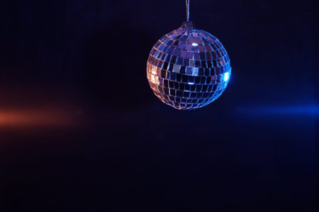 Disco ball with colored flash foils photographed in the studio