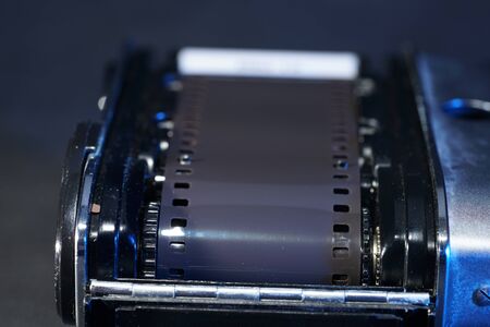 Film transport photographed on an old photo camera in the studio with flash lightの写真素材