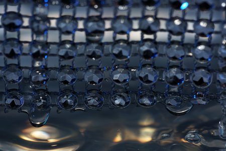 Water drops with high-speed flashes and automatic drip photographed in the studio