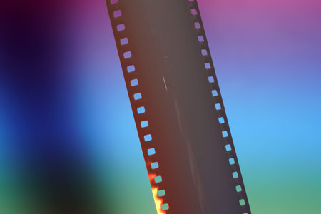 Film of an analogue camera with colorful background photographed in the studio