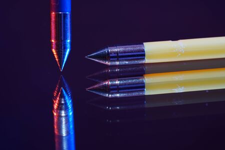 Ammunition for toy guns photographed on mirror in studioの写真素材