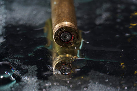 Ammunition for toy guns photographed on mirror in studio