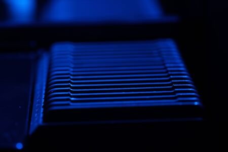 Old slide projector with slide frame photographed in the studio with flash lightの写真素材