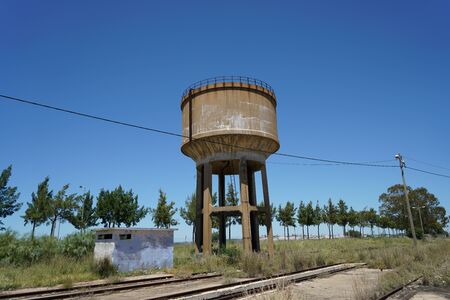 Hardened steel railroad tracks photographed on a sunny spring dayの写真素材