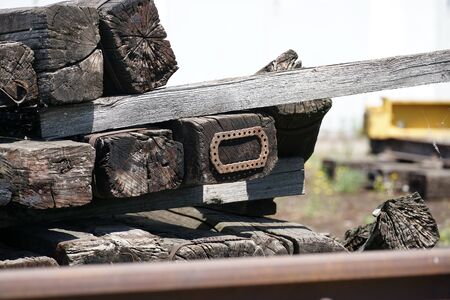 Old exchanged wooden railway sleepers stored for further useの写真素材