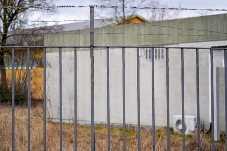 Fence wire photographed outdoors in the best of daylightの写真素材