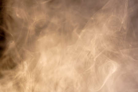 Smoke from an incense stick with color foils Photographed in the studioの写真素材