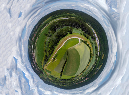 Spherical abstract panoramic aerial view in a field with fantastic beautiful clouds and curvature of...