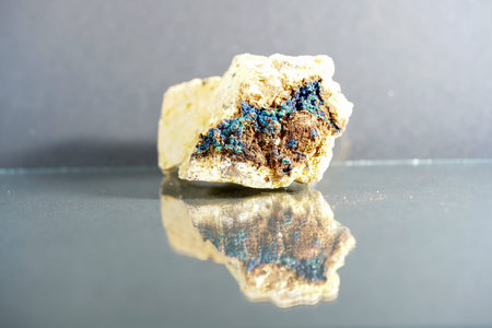 Quartz with mineral inclusions in the studio in front of black background photographed in marco mode