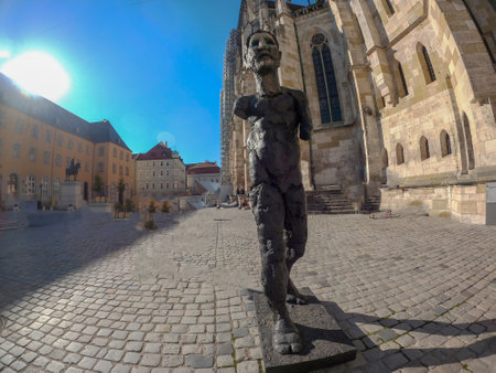 Regensburg photographed with wide angle with stone bridge over the Danube and cathedral and romantic alleysのeditorial素材