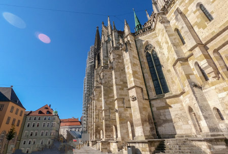 Regensburg photographed with wide angle with stone bridge over the Danube and cathedral and romantic alleysのeditorial素材