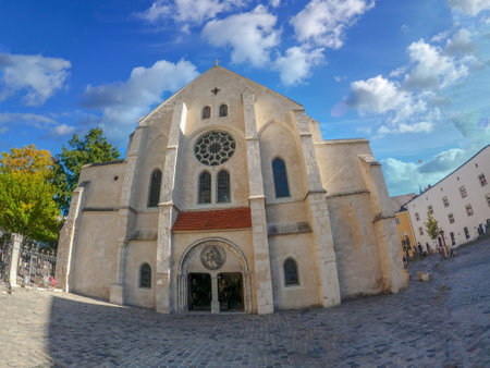Regensburg photographed with wide angle with stone bridge over the Danube and cathedral and romantic alleysのeditorial素材