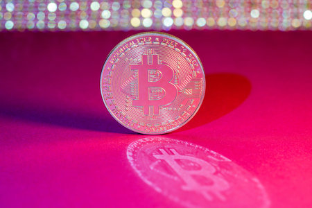 Bitcoin coin, medal photographed in the studio with long exposure reflection