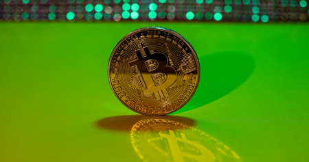 Bitcoin coin, medal photographed in the studio with long exposure reflectionの写真素材