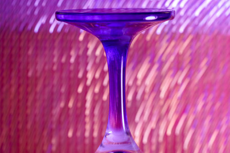 Glass made of crystal-like materials photographed in the studio with colorful backgroundの写真素材