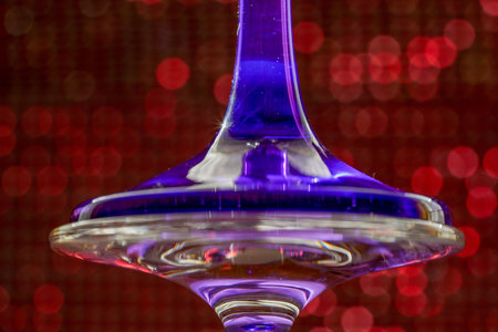 Glass made of crystal-like materials photographed in the studio with colorful background