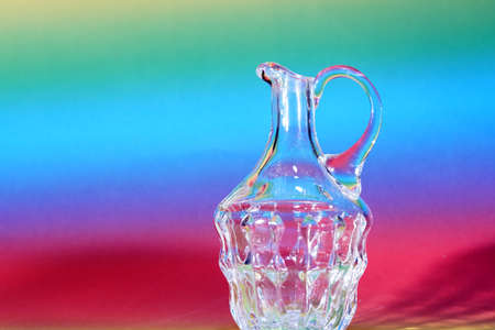 Glass made of crystal-like materials photographed in the studio with colorful backgroundの写真素材