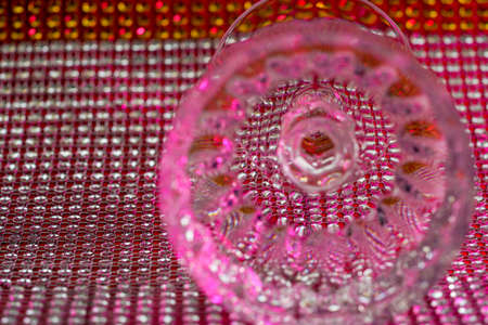 Glass made of crystal-like materials photographed in the studio with colorful backgroundの写真素材