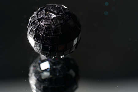 Disco ball with colored flash foils photographed in the studioの写真素材