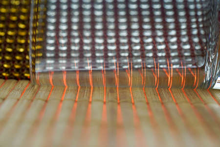 Glass made of crystal-like materials photographed in the studio with colorful backgroundの写真素材