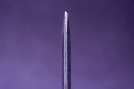 Hand-forged knife made of several layers of steel with an exclusive pattern photographed in the studioの写真素材