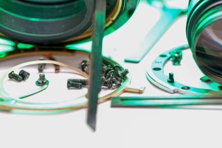 Background with different sizes of bolts, screws and nuts on a neutral surfaceの写真素材
