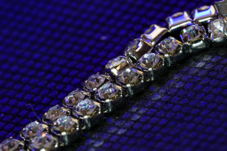 Silver chain for costume jewelry as a background image with copy space photographed in the studio