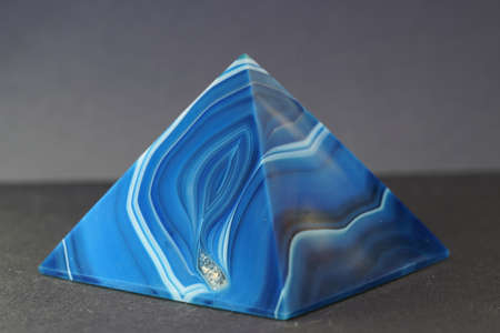 Blue violet pyramid of agate with quartz inclusions or worked as a discの写真素材