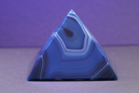Blue violet pyramid of agate with quartz inclusions or worked as a disc