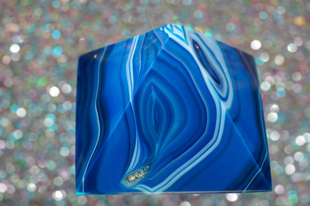 Blue violet pyramid of agate with quartz inclusions or worked as a discの写真素材